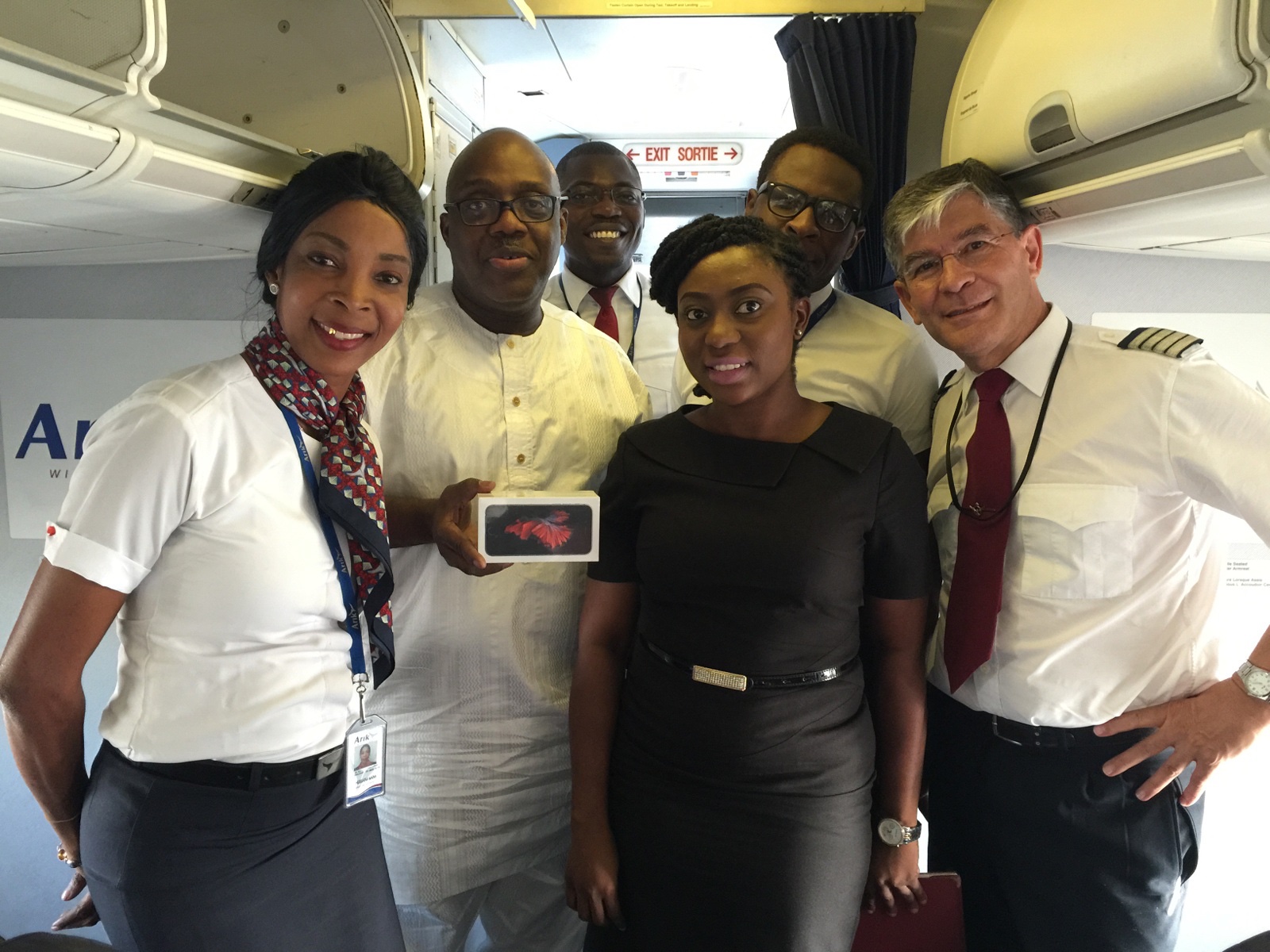 What is the customer service quality of Arik Air? Customer care is the core philosophy of Arik Air while a customer is receiving an Iphone from the Arik Air staff on-board